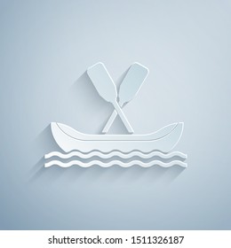 Paper cut Rafting boat icon isolated on grey background. Kayak with paddles. Water sports, extreme sports, holiday, vacation, team building. Paper art style. Vector Illustration