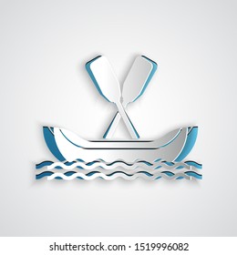 Paper cut Rafting boat icon isolated on grey background. Kayak with paddles. Water sports, extreme sports, holiday, vacation, team building. Paper art style. Vector Illustration