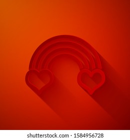 Paper cut Rainbow with heart icon isolated on red background. Paper art style. Vector Illustration