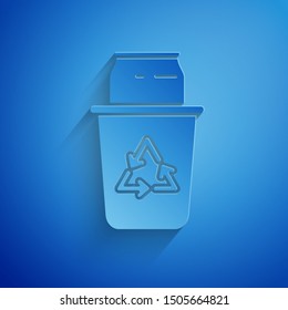 Paper cut Recycle bin with recycle symbol and can icon isolated on blue background. Trash can icon. Garbage bin sign. Recycle basket sign. Paper art style. Vector Illustration