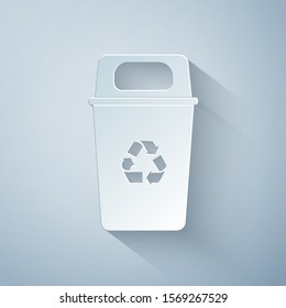 Paper cut Recycle bin with recycle symbol icon isolated on grey background. Trash can icon. Garbage bin sign. Recycle basket sign. Paper art style. Vector Illustration