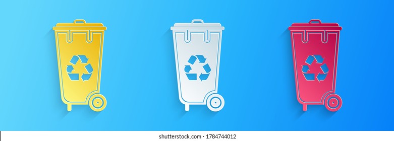 Paper cut Recycle bin with recycle symbol icon isolated on blue background. Trash can icon. Garbage bin sign. Recycle basket icon. Paper art style. Vector.