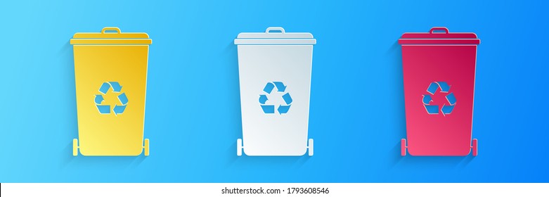 Paper cut Recycle bin with recycle symbol icon isolated on blue background. Trash can icon. Garbage bin sign. Recycle basket icon. Paper art style. Vector.