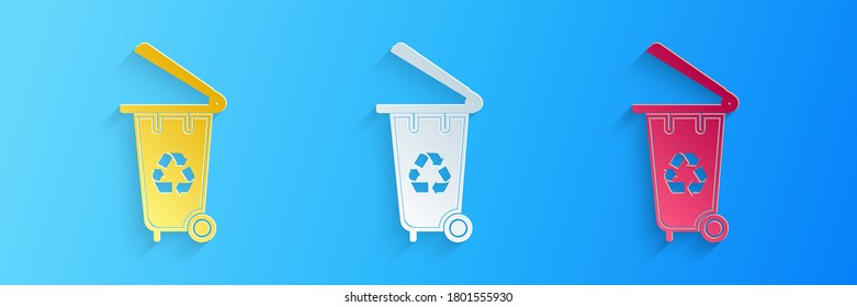 Paper cut Recycle bin with recycle symbol icon isolated on blue background. Trash can icon. Garbage bin sign. Recycle basket icon. Paper art style. Vector.
