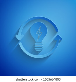 Paper cut Recycle and light bulb with lightning symbol icon isolated on blue background. Light lamp sign. Idea symbol. Paper art style. Vector Illustration