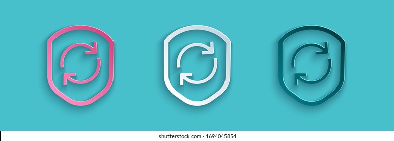 Paper cut Recycle symbol inside shield icon isolated on blue background. Eco protection sign. Paper art style. Vector Illustration
