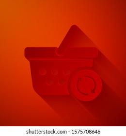 Paper cut Refresh shopping basket icon isolated on red background. Online buying concept. Delivery service sign. Update supermarket basket. Paper art style. Vector Illustration