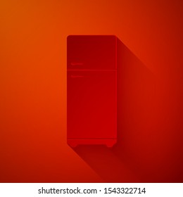 Paper cut Refrigerator icon isolated on red background. Fridge freezer refrigerator. Household tech and appliances. Paper art style. Vector Illustration