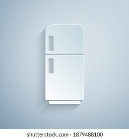 Paper cut Refrigerator icon isolated on grey background. Fridge freezer refrigerator. Household tech and appliances. Paper art style. Vector.