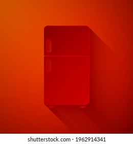 Paper cut Refrigerator icon isolated on red background. Fridge freezer refrigerator. Household tech and appliances. Paper art style. Vector