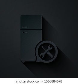 Paper cut Refrigerator with screwdriver and wrench icon isolated on black background. Adjusting, service, setting, maintenance, repair, fixing. Paper art style. Vector Illustration