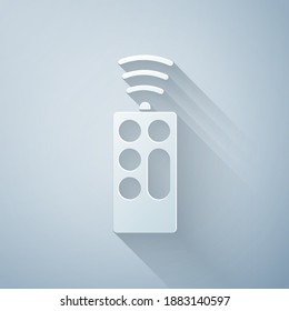Paper cut Remote control icon isolated on grey background. Paper art style. Vector