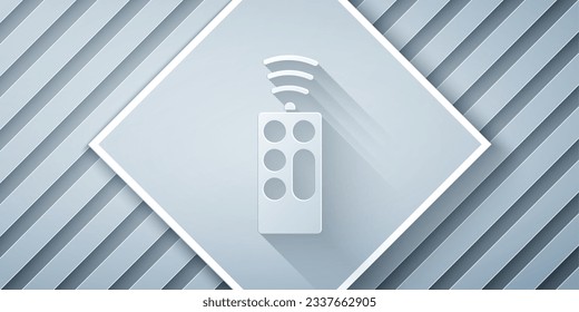 Paper cut Remote control icon isolated on grey background. Paper art style. Vector