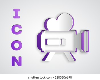 Recorte de papel Icono de la cámara de cine Retro aislado en fondo gris. Cámara de video. Signo de película. Proyector de película. Estilo de arte de papel. Vector