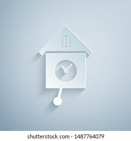Paper cut Retro wall watch icon isolated on grey background. Cuckoo clock sign. Antique pendulum clock. Paper art style. Vector Illustration