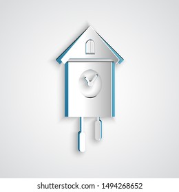 Paper cut Retro wall watch icon isolated on grey background. Cuckoo clock sign. Antique pendulum clock. Paper art style. Vector Illustration