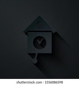 Paper cut Retro wall watch icon isolated on black background. Cuckoo clock sign. Antique pendulum clock. Paper art style. Vector Illustration