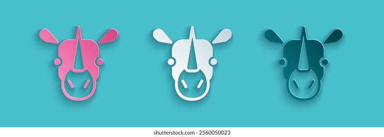 Paper cut Rhinoceros icon isolated on blue background. Animal symbol. Paper art style. Vector