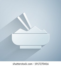 Paper cut Rice in a bowl with chopstick icon isolated on grey background. Traditional Asian food. Paper art style. Vector