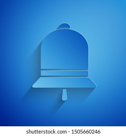 Paper cut Ringing bell icon isolated on blue background. Alarm symbol, service bell, handbell sign, notification symbol. Paper art style. Vector Illustration