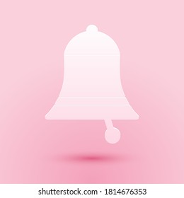 Paper cut Ringing bell icon isolated on pink background. Alarm symbol, service bell, handbell sign, notification symbol. Paper art style. Vector.