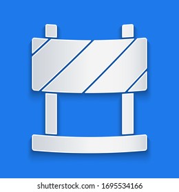 Paper cut Road barrier icon isolated on blue background. Symbol of restricted area which are in under construction processes. Repair works. Paper art style. Vector Illustration