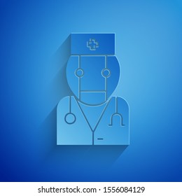 Paper cut Robot doctor icon isolated on blue background. Medical online consultation robotic silhouette artificial intelligence. Paper art style. Vector Illustration