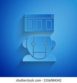 Paper cut Robot icon isolated on blue background. Paper art style. Vector Illustration