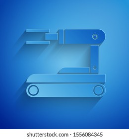 Paper cut Robot icon isolated on blue background. Paper art style. Vector Illustration
