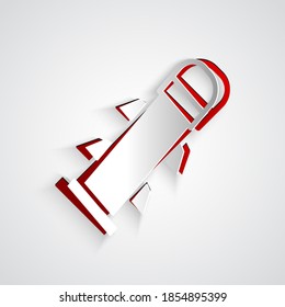 Icono del cohete de corte de papel aislado en fondo gris. Estilo de arte de papel. Vector