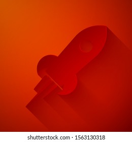 Paper cut Rocket ship with fire icon isolated on red background. Space travel. Paper art style. Vector Illustration