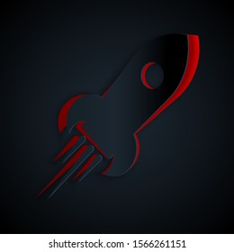 Paper cut Rocket ship with fire icon isolated on black background. Space travel. Paper art style. Vector Illustration