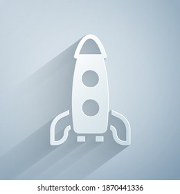 Paper cut Rocket ship icon isolated on grey background. Space travel. Paper art style. Vector