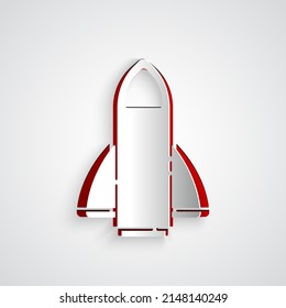 Paper cut Rocket ship icon isolated on grey background. Space travel. Paper art style. Vector