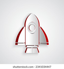 Paper cut Rocket ship icon isolated on grey background. Space travel. Paper art style. Vector