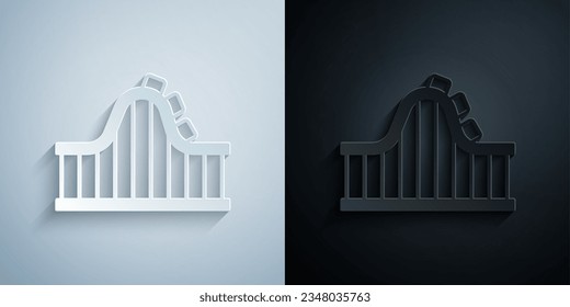 Paper cut Roller coaster icon isolated on grey and black background. Amusement park. Childrens entertainment playground, recreation park. Paper art style. Vector