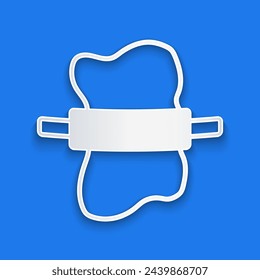 Paper cut Rolling pin on dough icon isolated on blue background. Paper art style. Vector
