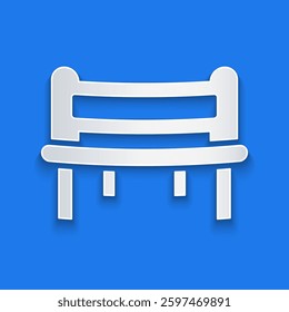 Paper cut Romantic bench icon isolated on blue background. Paper art style. Vector