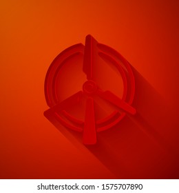 Paper cut Rotating wind turbine icon isolated on red background. Wind generator sign. Windmill for electric power production. Paper art style. Vector Illustration