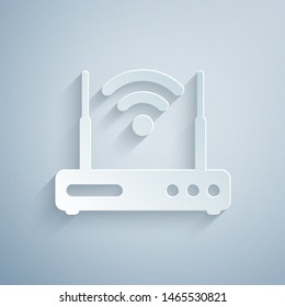 Paper cut Router and wi-fi signal symbol icon isolated on grey background. Wireless ethernet modem router. Computer technology internet. Paper art style. Vector Illustration