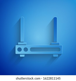 Paper cut Router and wi-fi signal symbol icon isolated on blue background. Wireless ethernet modem router. Computer technology internet. Paper art style. Vector Illustration