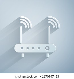 Paper cut Router and wi-fi signal symbol icon isolated on grey background. Wireless ethernet modem router. Computer technology internet. Paper art style. Vector Illustration
