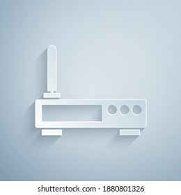 Paper cut Router and wi-fi signal icon isolated on grey background. Wireless ethernet modem router. Computer technology internet. Paper art style. Vector.