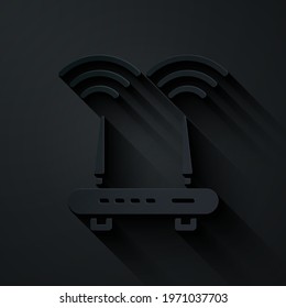 Paper cut Router and wi-fi signal icon isolated on black background. Wireless ethernet modem router. Computer technology internet. Paper art style. Vector