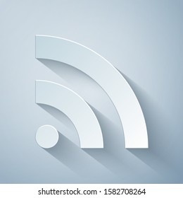 Paper cut RSS icon isolated on grey background. Radio signal. RSS feed symbol. Paper art style. Vector Illustration