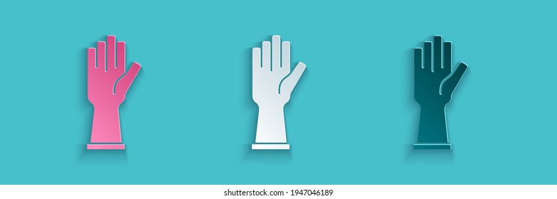 Paper cut Rubber gloves icon isolated on blue background. Latex hand protection sign. Housework cleaning equipment symbol. Paper art style. Vector