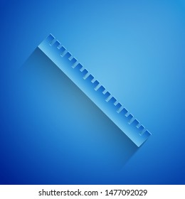 Paper cut Ruler icon isolated on blue background. Straightedge symbol. Paper art style. Vector Illustration