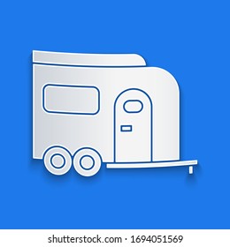 Paper cut Rv Camping trailer icon isolated on blue background. Travel mobile home, caravan, home camper for travel. Paper art style. Vector Illustration