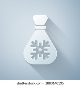 Paper cut Santa Claus bag gift icon isolated on grey background. Christmas presents sack. Merry Christmas and Happy New Year. Paper art style. Vector