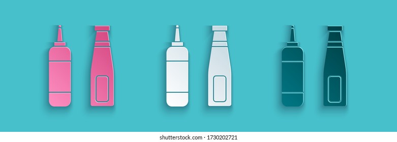 Paper cut Sauce bottle icon isolated on blue background. Ketchup, mustard and mayonnaise bottles with sauce for fast food. Paper art style. Vector Illustration